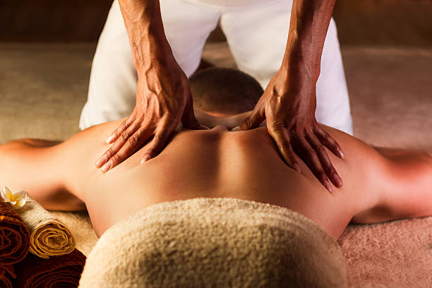Man has deep tissue massage on the back.